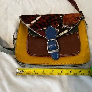 Great small purse with lots of personality! Like new condition leather